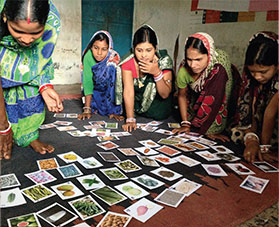 Women go through a card sorting exercise.