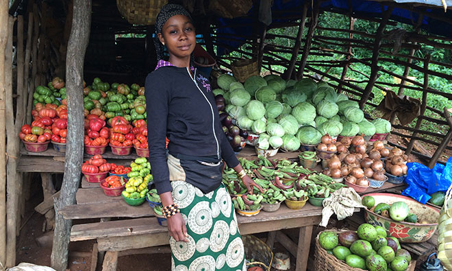 Market vegetable seller with her wares
