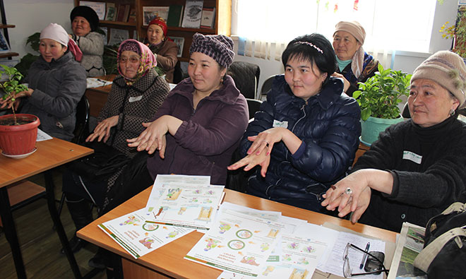 A group of women attending a handwashing seminar.