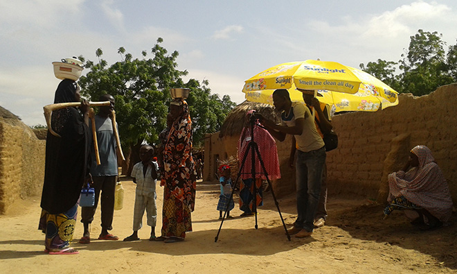 Photo of a group filming a community video.