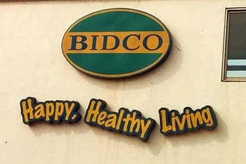 Sign on the gate of the BIDCO factory.