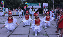 Local dance group “Jash Kiyal” performs traditional dances as part of SPRING’s World Breastfeeding Week event in Kara Kul