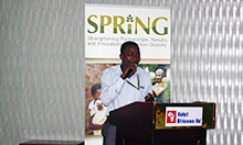 Photo: SPRING staff member Mike Mazinga presents on the current status of maize milling in Uganda.