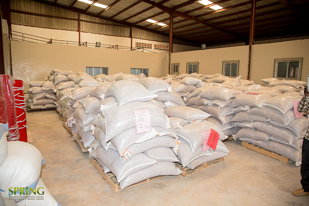 Packed sacks of groundnuts and other production ingredients.