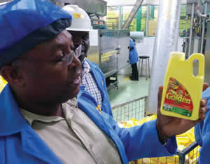 Vitamin A-fortified oil at a factory in Uganda.