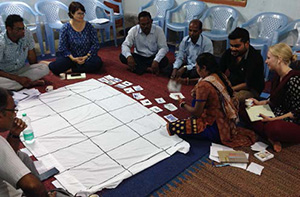  Enumerators practice facilitating a daily activity chart exercise during training.