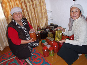Jumgal women with their preserved vegetables