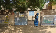 Photo of a woman walking by a clinic - credit: Sally Abbott, PhD