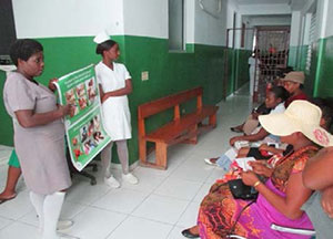 Nurses at the improved prenatal clinic lead group education about nutrition with pregnant women awaiting consultations.