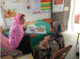 Jesmin Sultana counseling a lactating woman. Since receiving training, Jesmin confidently provides information on topics such as when and what to feed infants and how to tell if infants are receiving enough milk.