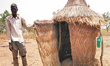 Gmangun Charles shows off his household’s new latrine in the Kubone community in Ghana’s northern region.