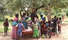 Cover photo: a group of several mothers and their children gathered outside by a tree. Photo by Souleymane Ouattara, Jade Video Production.