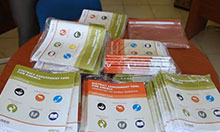 A table with stacks of copies of the DATA tool materials.