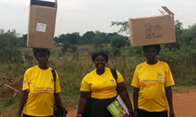 Village health team members with boxes on MNPs and related materials